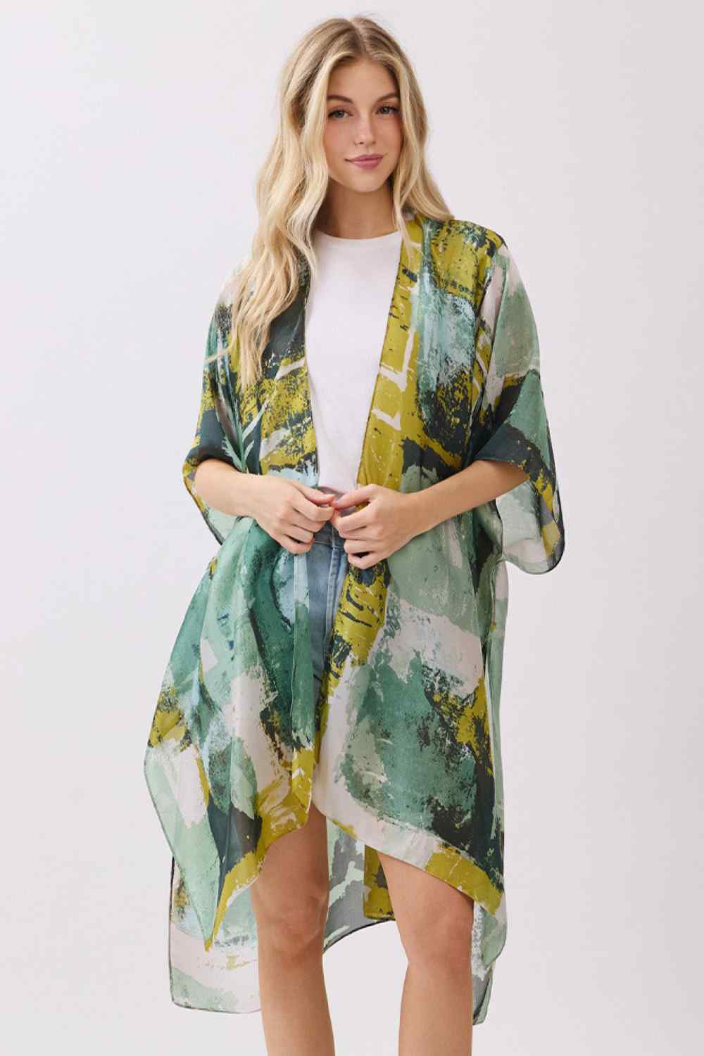 Green Elevate your beach or resort wardrobe with this stunning Abstract Modern Art-Inspired Print Kimono. Crafted from 100% polyester with a luxuriously silky feel, this cover-up drapes beautifully over swimwear or casual outfits. The bold, contemporary print adds an artistic flair to any look, while the generous 35" x 36" dimensions provide comfortable coverage. Perfect for poolside lounging, beach days, or layering over your favorite pieces. Lightweight and easy to care for, this kimono is an effortless w