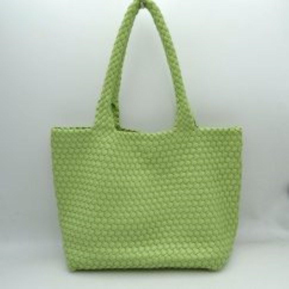Green This structured tote bag features an intricate basket-weave design across its body and integrated shoulder straps, creating a textured look suitable for everyday use. The main storage compartment offers a wide, open-top design for easy access to daily essentials. Accompanying the larger bag is a matching smaller pouch with a distinct woven exterior pattern and a secure gold-tone top zipper closure to keep smaller items organized.