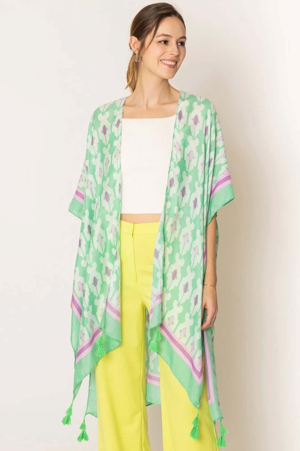 Green Effortless elegance meets bohemian charm with this stunning tile print kimono. Crafted from lightweight 100% polyester, this versatile piece features a captivating geometric tile pattern with contrasting stripe detailing along the edges and playful tassels for added movement and flair. Perfect for layering over any outfit, this kimono drapes beautifully at 35.4" x 35.4", making it ideal for beach days, casual outings, or relaxed evenings. 