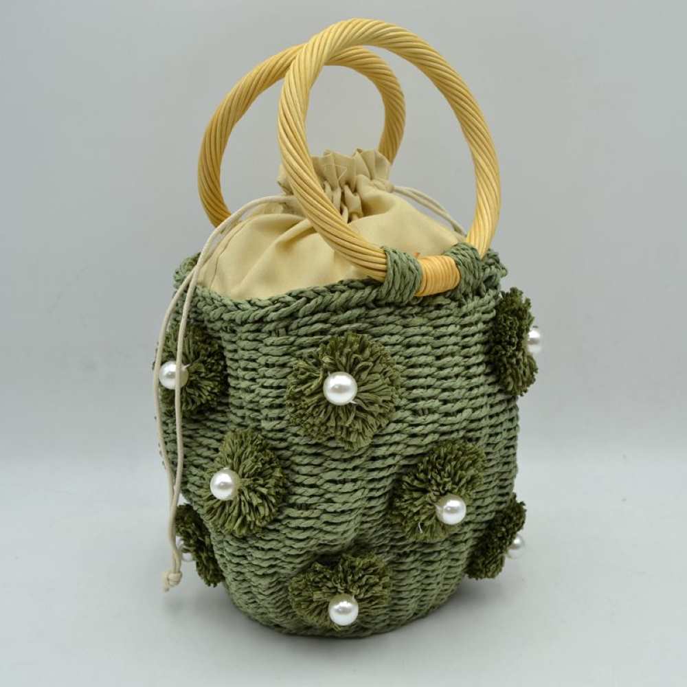 Green Infuse your daily style with a touch of resort-inspired luxury. This sophisticated bucket-style shoulder bag perfectly blends the airy feel of a woven summer tote with the structured polish of premium black accents, making it an incredibly versatile accessory for work, travel, or weekend getaways.