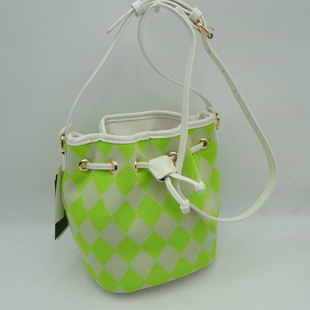 Green This everyday bucket bag features a distinctive argyle diamond pattern across its structured main body. Ideal for daily use, it is designed with a long, adjustable shoulder strap connected via metallic side rings. The spacious main storage compartment features an open-top design that closes with a functional drawstring woven through integrated metallic grommets along the upper rim, securing at the front with a knotted tie accent.