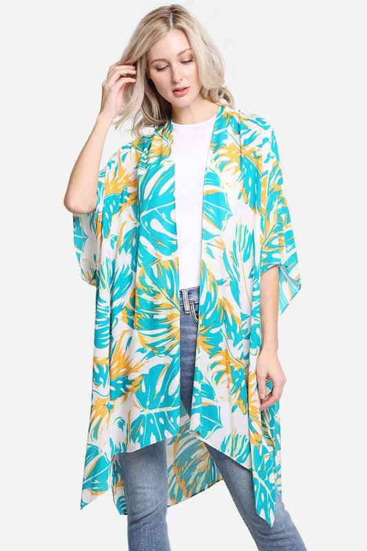Green Effortless elegance meets tropical style with this Monstera Leaves Print Cover Up. Crafted from 100% viscose, this lightweight fabric drapes beautifully and feels luxuriously soft against your skin. The botanical print brings a fresh, nature-inspired aesthetic perfect for beach days, poolside lounging, or casual outings. Generously sized at 38" x 39", it offers comfortable coverage and versatile styling options. Whether layered over a swimsuit or worn as a standalone piece, this cover up combines comf