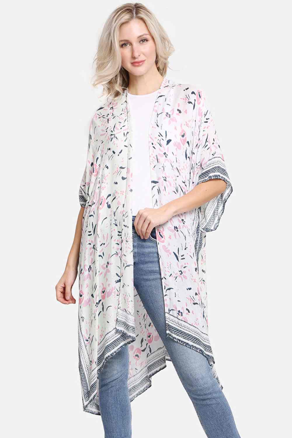 Green Effortless summer style meets comfort in this vibrant multi-colored floral pattern cover-up. Crafted from 100% viscose, the lightweight fabric drapes beautifully while keeping you cool and comfortable. Perfect for beach days, poolside lounging, or casual outings, this versatile piece transitions seamlessly from day to night. Dimensions: 38" x 39". Made in China.