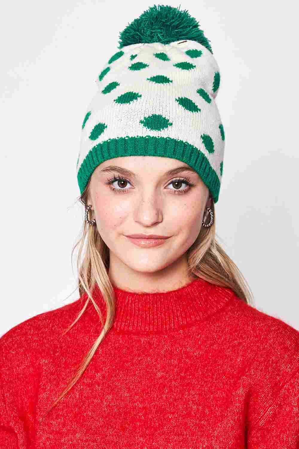 Green Polka Dot Christmas Holiday Theme Pom Beanie features festive polka-dot detailing topped with a fluffy pom for a cheerful seasonal look. Made with a soft stretch fit, it keeps you warm and cozy while adding playful holiday charm to your winter outfits.