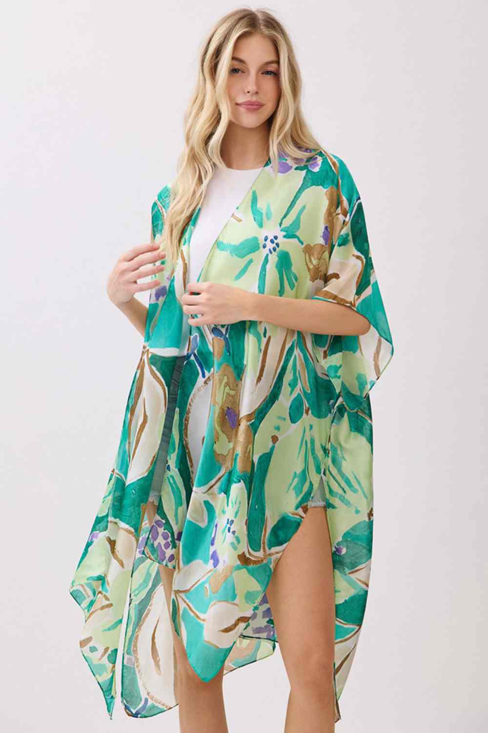 Green Wrap yourself in effortless elegance with this vibrant botanic print kimono cover-up. Crafted from 100% polyester with a luxuriously silky feel, it drapes beautifully over swimwear, dresses, or casual outfits. The generous 35" x 36" dimensions provide comfortable coverage and movement. Perfect for beach days, resort wear, or layering during warmer months. A versatile piece that brings color and sophistication to any warm-weather wardrobe.