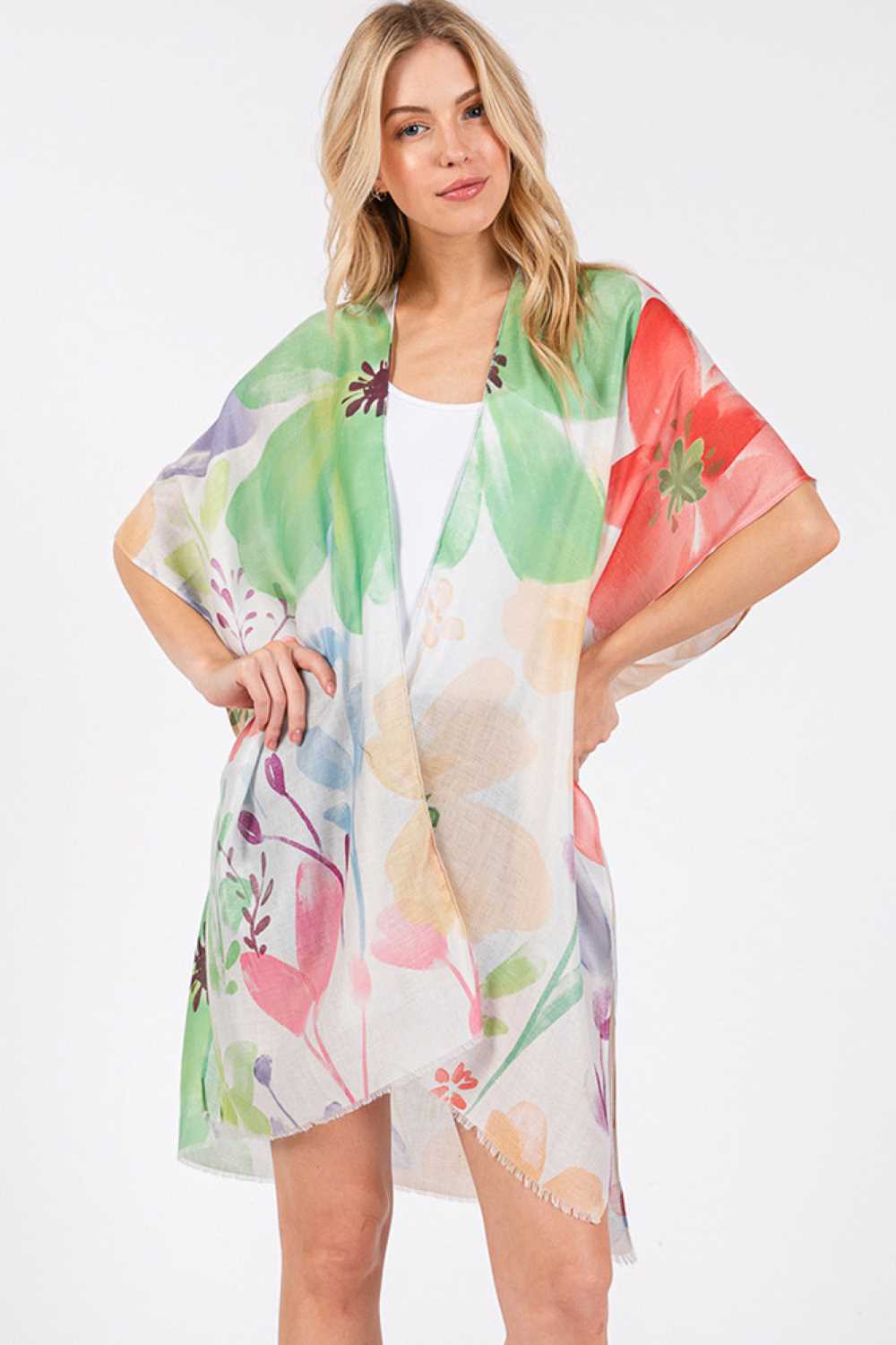 Green Embrace effortless summer style with this stunning water color floral kimono cover-up. Featuring a vibrant, artistic floral print in soft watercolor hues, it's the perfect lightweight layer for beach days, poolside lounging, or casual outings. Crafted from 100% polyester, this kimono offers breathable comfort and easy care. The generous 35" x 36" dimensions provide relaxed, flowing coverage that flatters all body types. Slip it on over your swimsuit or favorite summer dress for an instantly polished l