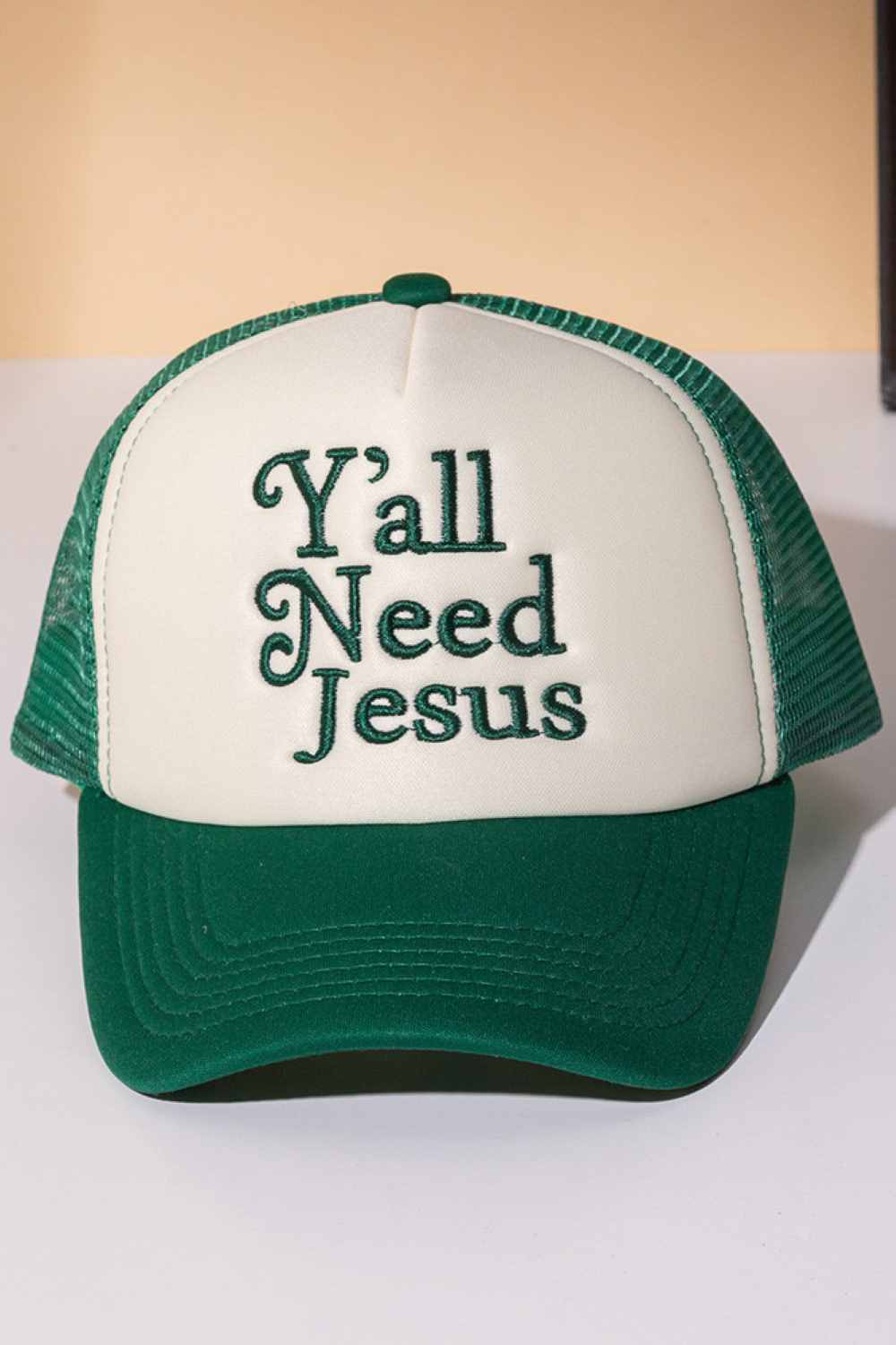 Green Y'ALL NEED JESUS Letter Foam with Mesh Back Trucker Hat Baseball Cap Make a bold statement with this classic trucker cap featuring embroidered lettering across the front. Crafted from 100% polyester with a breathable mesh back panel, it's designed for all-day comfort and ventilation. The structured foam front provides durability and shape retention, while the adjustable snapback closure ensures a perfect fit for most head sizes. Whether you're heading to the gym, running errands, or making a fashion s
