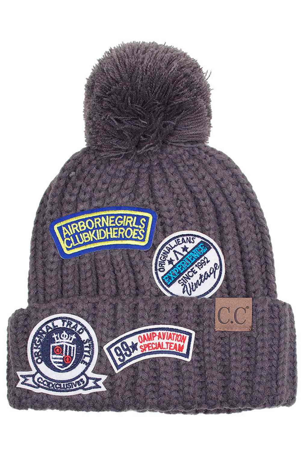 Grey Stay warm in style with the C.C Fashion Pom Beanie With Patch. Crafted from 100% soft acrylic, this cozy beanie delivers exceptional comfort and durability for everyday wear. The signature pom pom adds a playful touch, while the decorative patch showcases timeless fashion appeal. One size fits most, making it the perfect accessory for anyone seeking quality and versatility. Whether you're heading outdoors or running errands, this beanie combines practicality with contemporary design.