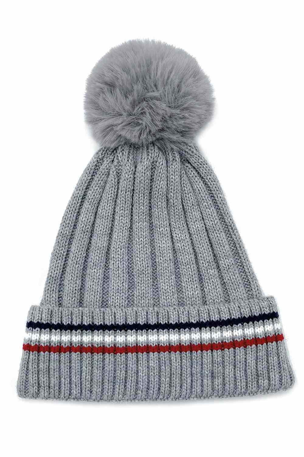 Grey Add a cozy-chic touch to your winter wardrobe with this Stripe Rib Super Soft Cuff Beanie, designed for warmth and everyday comfort. Finished with a luxurious faux fur pom, it delivers a stylish look while keeping you snug on colder days.