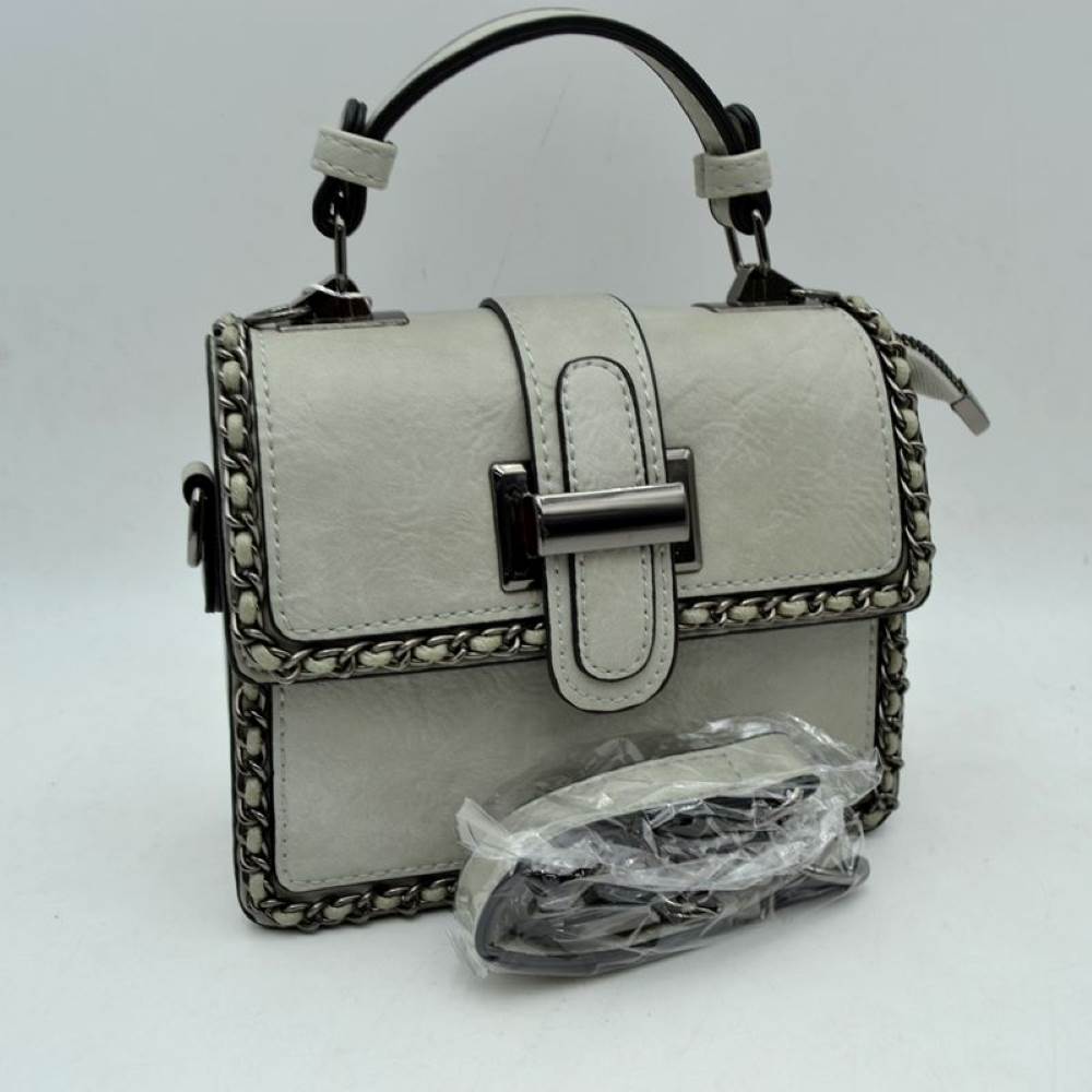 Grey Add a touch of structured elegance to your look with this chic top-handle satchel bag. Designed for the modern trendsetter, it seamlessly blends classic vintage vibes with contemporary edgy accents.