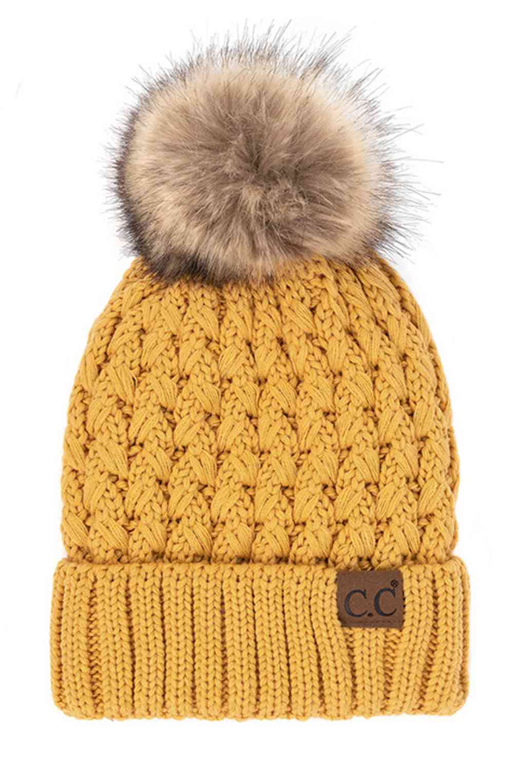 Mustard Elevate your winter wardrobe with the C.C Lattice Crossover Stitch Beanie, featuring an intricate lattice pattern and cozy pom detail. Crafted from 100% soft acrylic, this beanie delivers warmth and comfort without the weight. The crossover stitch design adds visual interest while the relaxed fit suits most face shapes. Perfect for layering over your favorite winter looks, this versatile beanie transitions effortlessly from casual outings to outdoor adventures. One size fits most for easy, everyday 