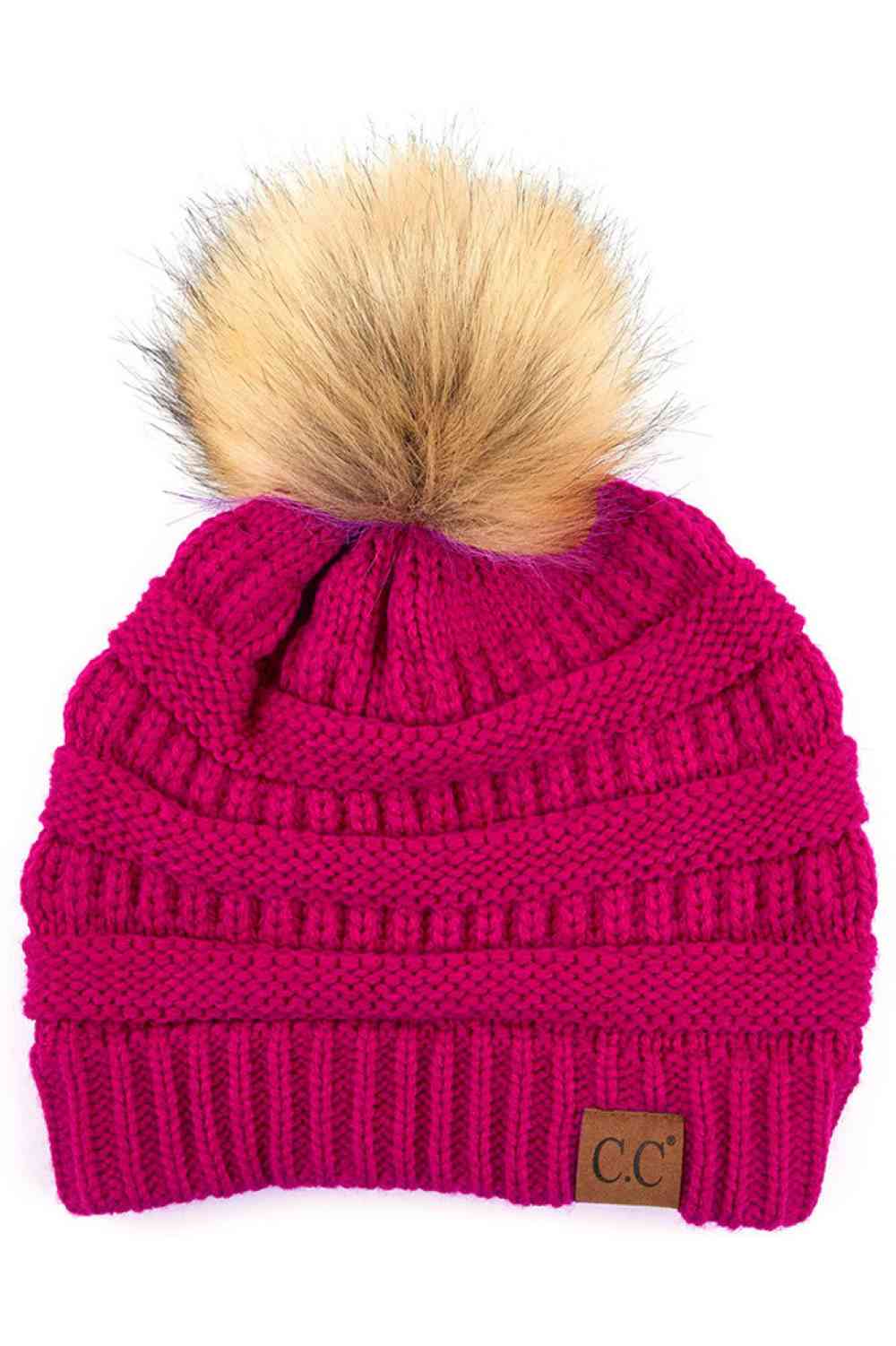 Honey Mustard Stay warm and cozy with this classic C.C Pom Pom Knit Beanie, crafted from 100% soft acrylic for all-day comfort. The ribbed knit design adds texture and durability, while the signature pom pom on top brings a playful touch to any winter outfit. One size fits most, making it the perfect accessory for everyone. Ideal for cold weather adventures or casual everyday wear.