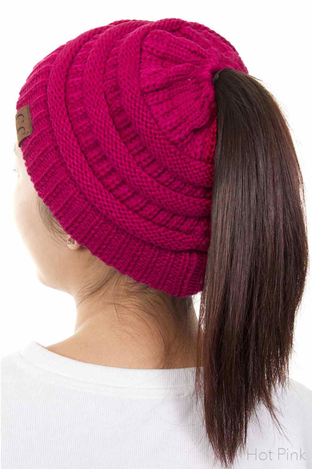 Hot pink The C.C Solid Color Ponytail Messy Bun Beanie combines comfort with versatility for effortless everyday style. Crafted from 100% soft acrylic, this beanie features an open crown design that accommodates ponytails and messy buns while keeping you warm. The one-size-fits-most construction ensures a secure, flattering fit for virtually anyone. Perfect for casual outings, workouts, or relaxed weekends, this practical accessory transitions seamlessly from season to season.