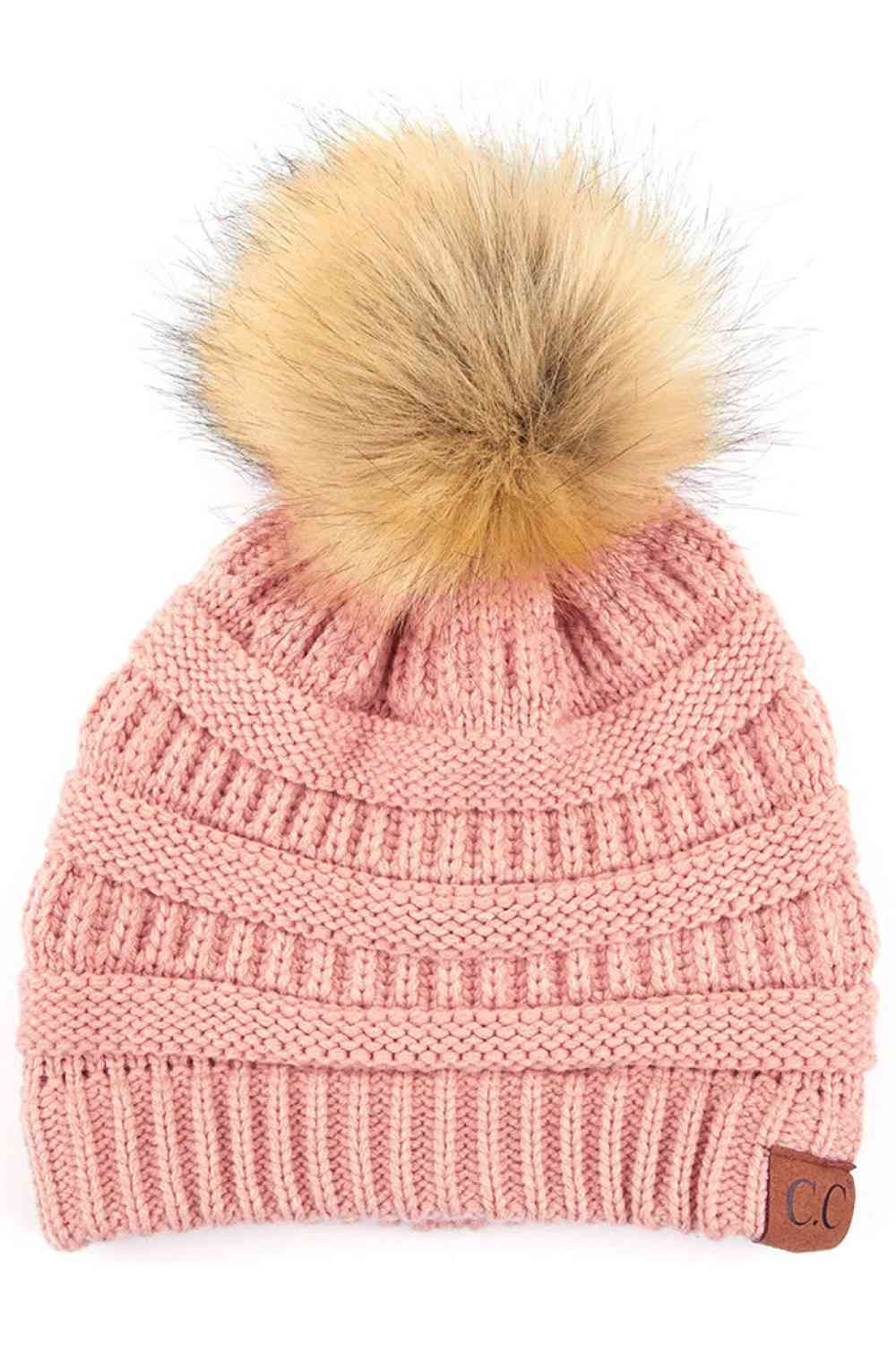 Indi Pink Stay warm and cozy with this classic C.C Pom Pom Knit Beanie, crafted from 100% soft acrylic for all-day comfort. The ribbed knit design adds texture and durability, while the signature pom pom on top brings a playful touch to any winter outfit. One size fits most, making it the perfect accessory for everyone. Ideal for cold weather adventures or casual everyday wear.