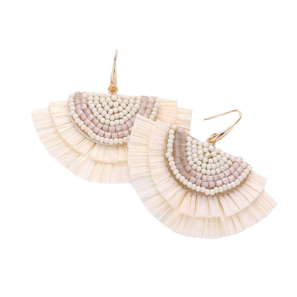 Ivory Bead Embellished Raffia Fringe Dangle Earrings, adorn yourself with these Raffia fringe dangle earrings! Enhance your attire with these vibrant artisanal earrings to show off your fun trendsetting style. 