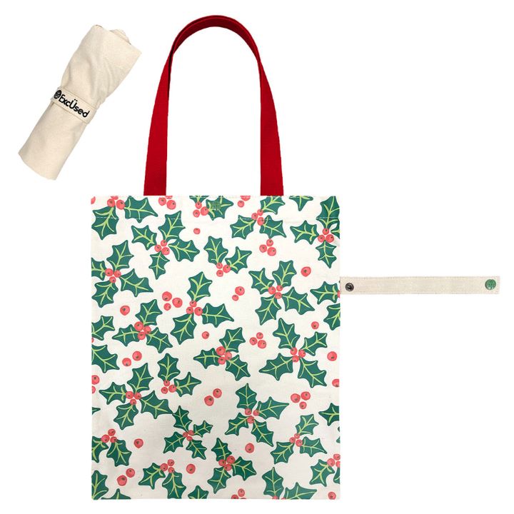 Reusable Christmas tote bag featuring a festive holly and berry print. Ideal for holiday shopping, gifting, or seasonal outings. Durable and stylish, it's a cheerful addition to your holiday essentials.