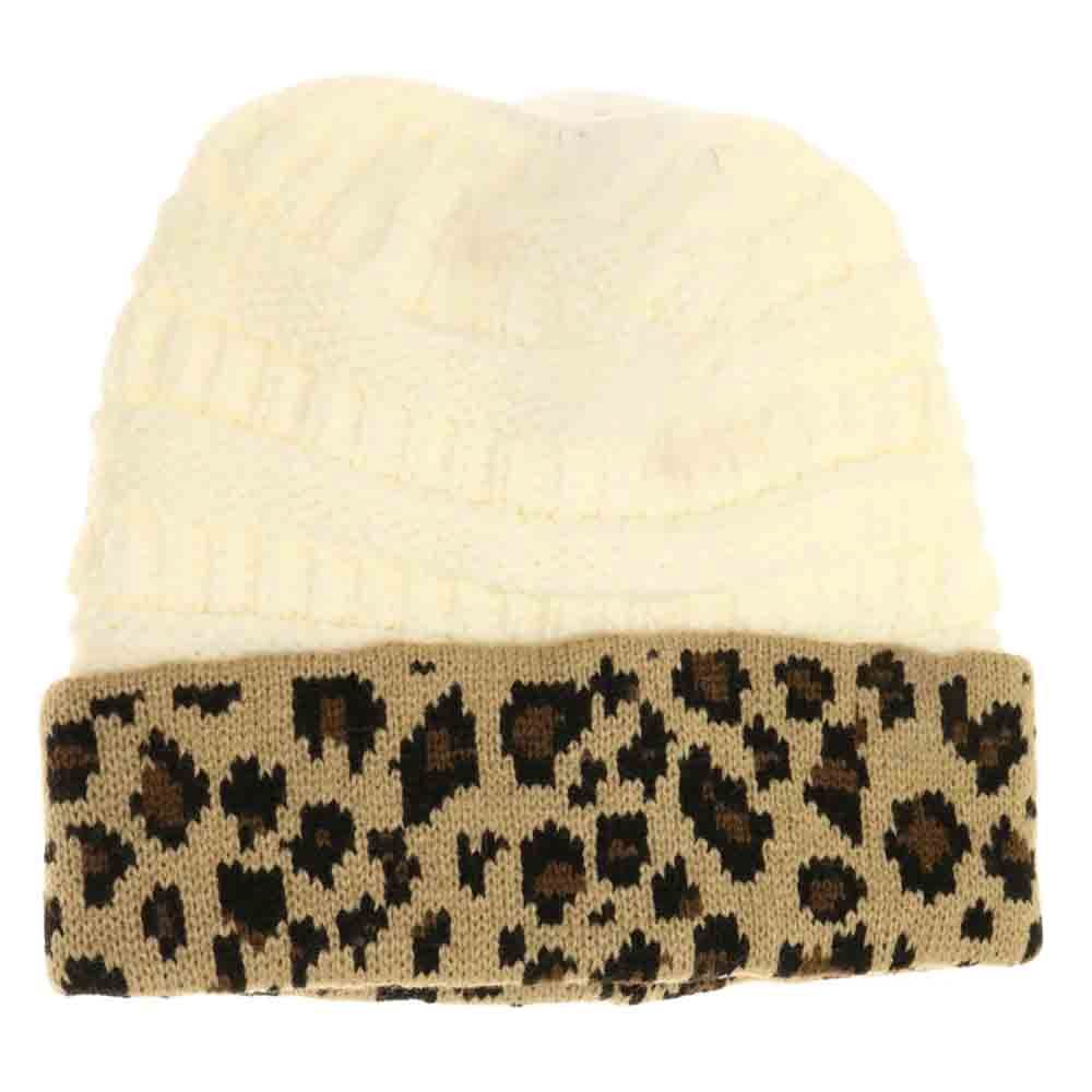 Ivory Leopard Print CC Beanie Tail combines stylish leopard patterning with practical design, featuring a convenient tail opening perfect for ponytails or buns. Crafted from soft, breathable fabric, this beanie ensures comfortable wear during colder days while keeping your hair effortlessly in place. Ideal for outdoor activities or casual outings, it offers a blend of fashion and function that enhances your winter wardrobe. 