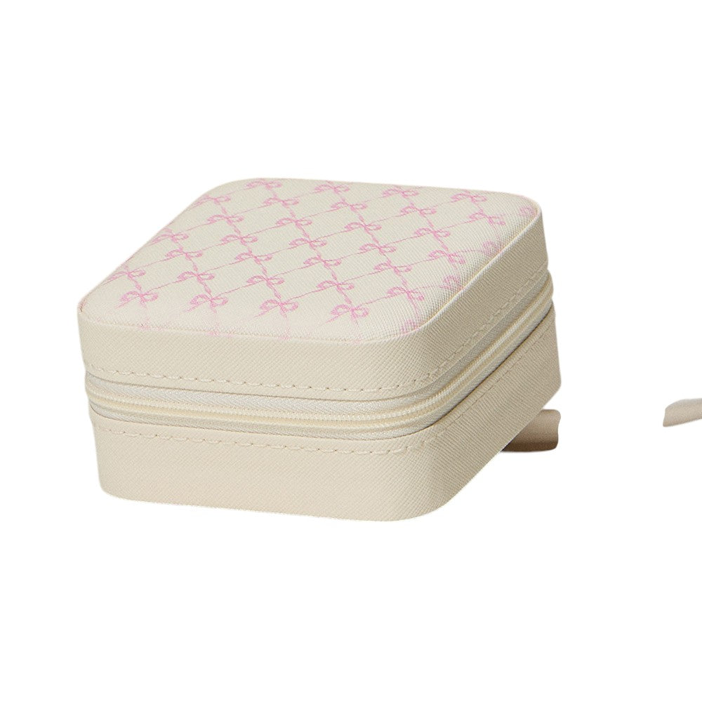 Ivory Pink Bow Pattern Portable Square Jewelry Box is perfect for storing and organising your precious jewellery. The elegant pink bow pattern adds a touch of style, making it a great addition to your dressing table or as a gift. Its compact size makes it ideal for travelling.