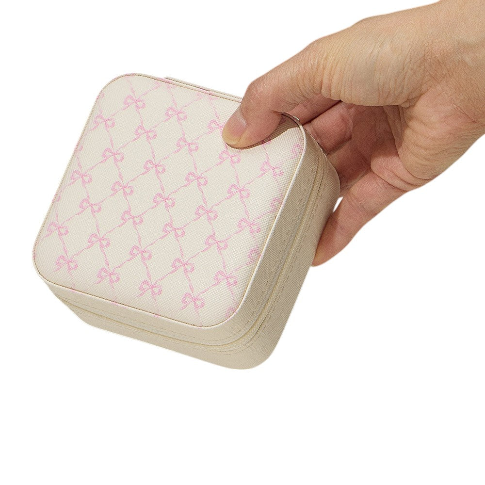 Ivory Pink Bow Pattern Portable Square Jewelry Box is perfect for storing and organising your precious jewellery. The elegant pink bow pattern adds a touch of style, making it a great addition to your dressing table or as a gift. Its compact size makes it ideal for travelling.