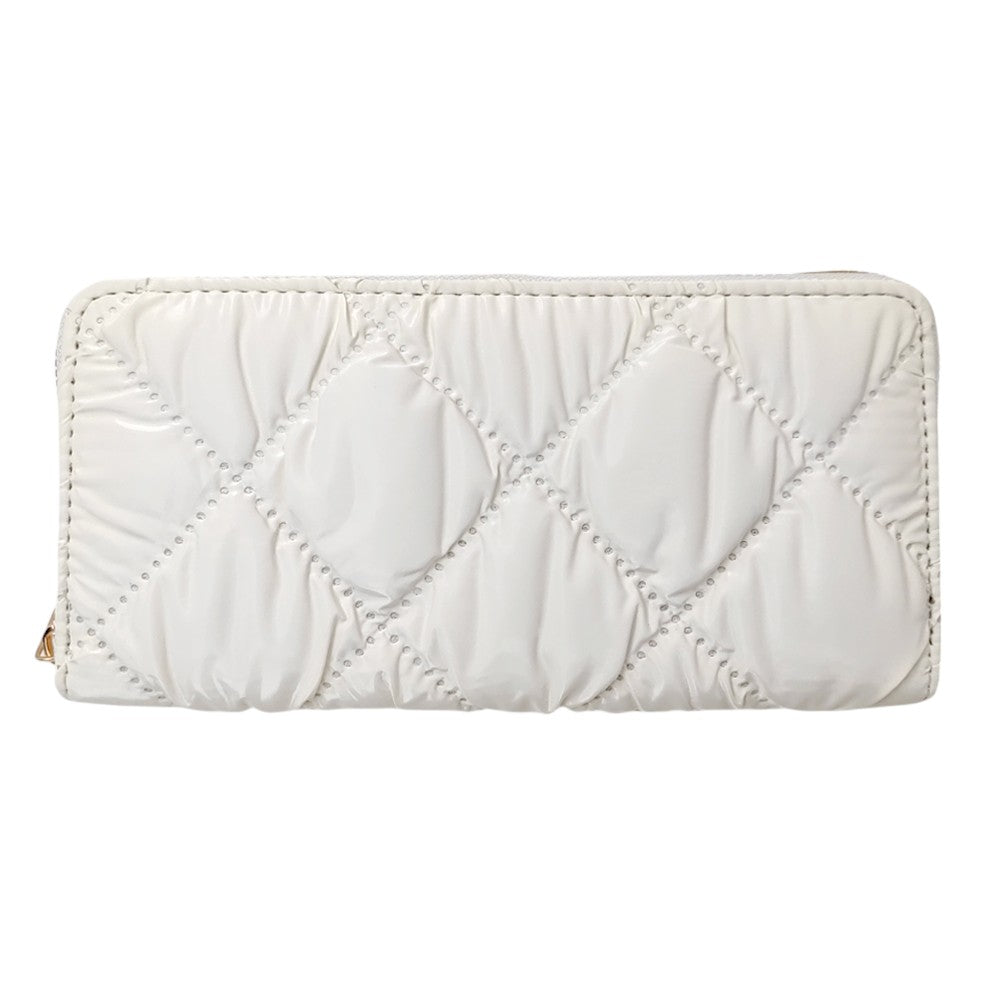 Ivory Shiny Faux Leather Padded Wallet with Wristlet offers a sleek and stylish solution for storing your essentials. Its shiny faux leather material adds a touch of sophistication, while the padded design keeps your valuables safe. The attached wristlet also provides convenience and hands-free carrying. 