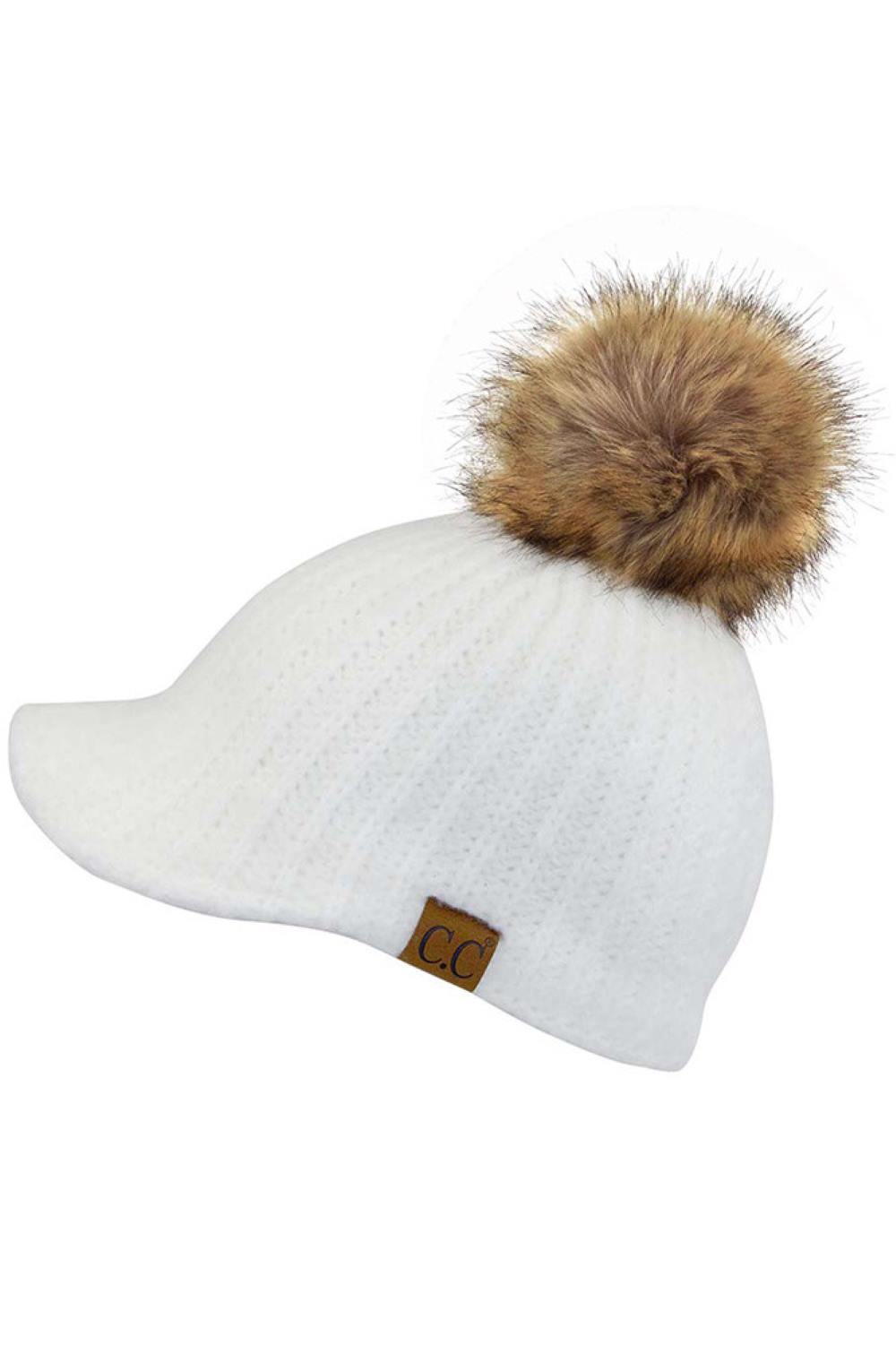 Ivory Stay cozy with this knitted brim beanie featuring a plush pom pom detail. Crafted from a soft blend of 75% acrylic, 22% polyester, and 3% spandex, this winter essential delivers warmth and comfort in a versatile style. Available in nine rich colors including Beige, Berry, Dark Denim, Heather Gray, Ivory, Pistachio, Rose, Steel Blue, and Violet Purple. The ribbed knit construction and faux fur pom add texture and visual interest to any cold-weather outfit. Hand wash and lay flat to dry for lasting qual