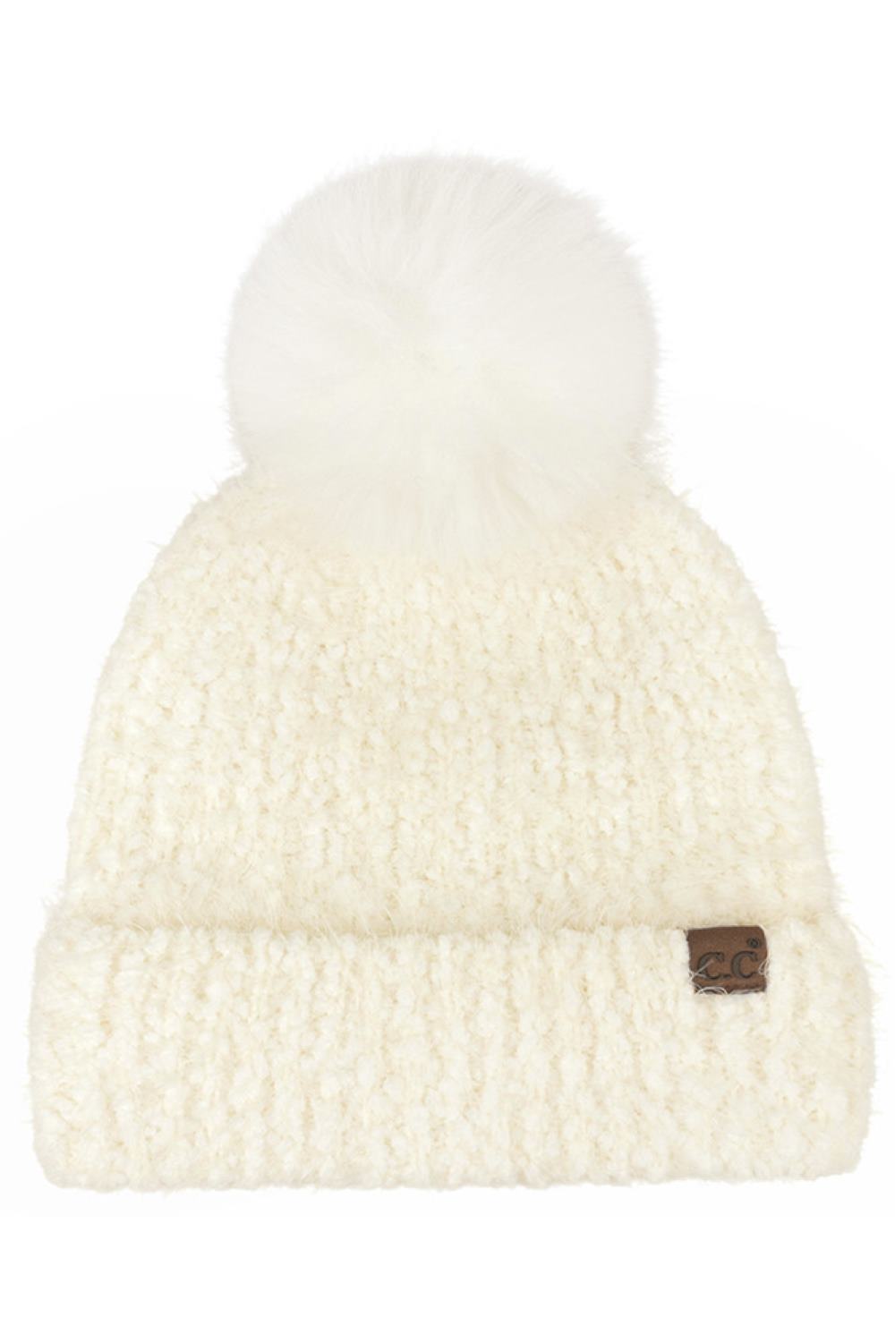 Ivory C.C Faux Fur Pom Boucle Cuff Beanie Winter Hat features cozy boucle knit paired with a plush faux-fur pom for a stylish, winter-ready finish. Designed with a soft cuff and stretch fit, it delivers warm comfort while adding effortless charm to your cold-weather looks.