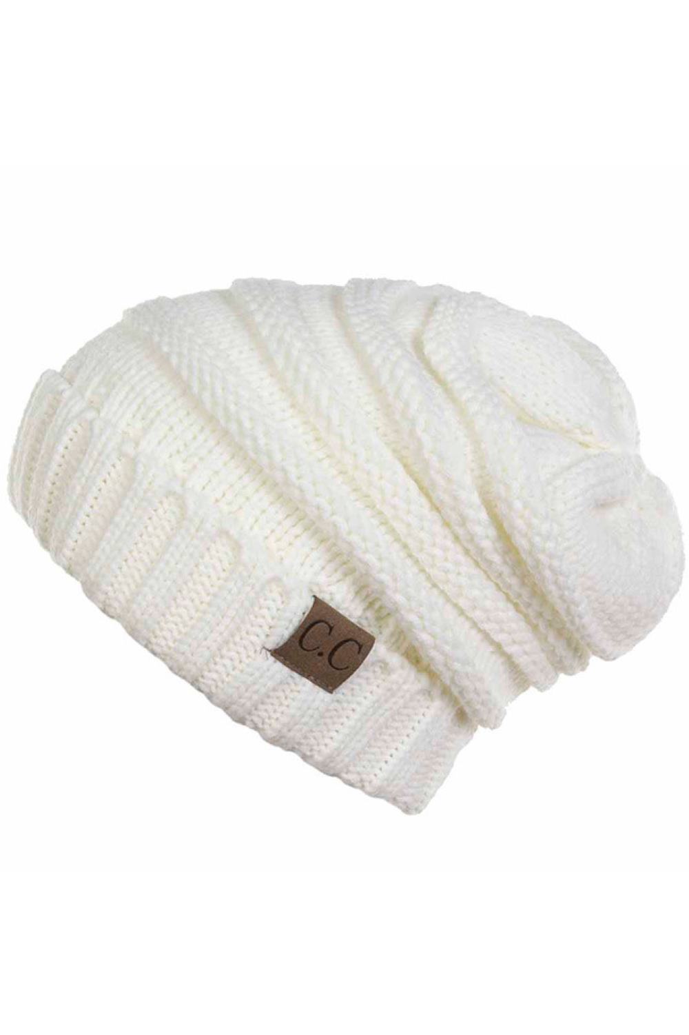 Ivory Camel Wrap yourself in warmth with this C.C Slouchy Knitted Beanie, crafted from 100% soft acrylic for ultimate comfort. The oversized silhouette and plush pom pom detail create a relaxed, on-trend look perfect for chilly days. Available in nine versatile colors—Beige, Berry, Dark Denim, Heather Gray, Ivory, Pistachio, Rose, Steel Blue, and Violet Purple—this beanie pairs effortlessly with any winter wardrobe. The ribbed knit construction ensures durability and a flattering fit.