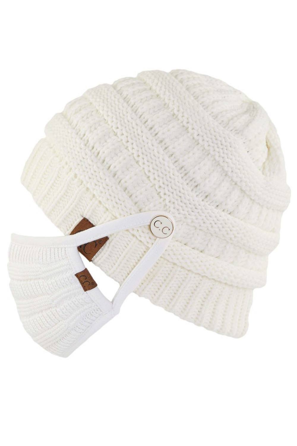 Ivory Stay warm and functional with this C.C Ribbed Knit Beanie featuring a convenient button attachment for your mask. Crafted from 100% acrylic, this lightweight beanie offers soft comfort and durability for everyday wear.