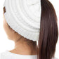 Ivory The C.C Solid Color Ponytail Messy Bun Beanie combines comfort with versatility for effortless everyday style. Crafted from 100% soft acrylic, this beanie features an open crown design that accommodates ponytails and messy buns while keeping you warm. The one-size-fits-most construction ensures a secure, flattering fit for virtually anyone. Perfect for casual outings, workouts, or relaxed weekends, this practical accessory transitions seamlessly from season to season.