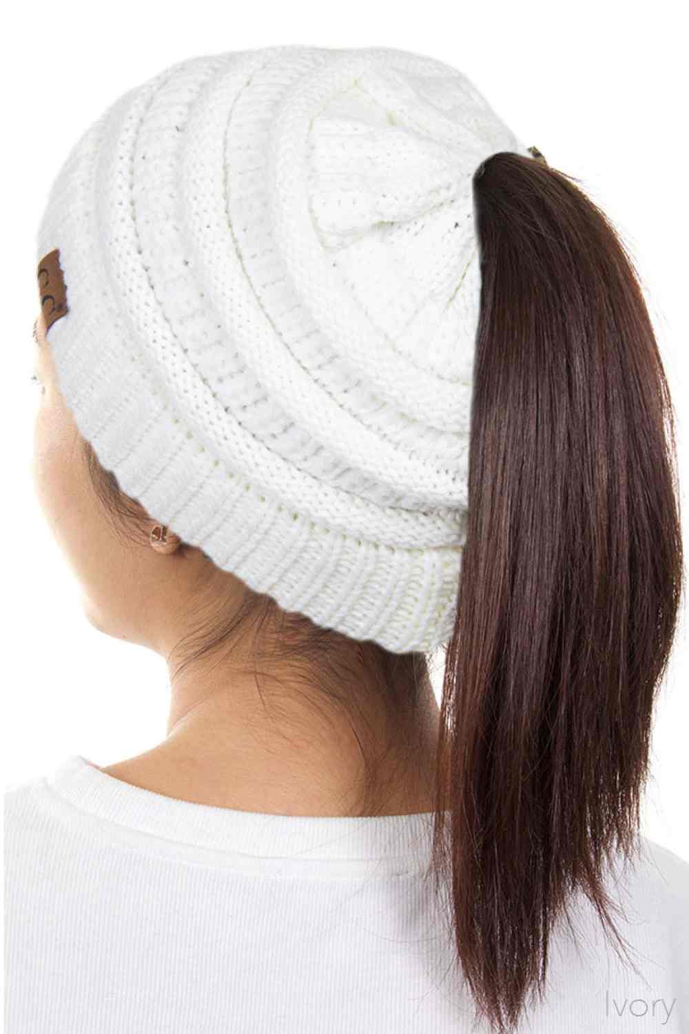 Ivory The C.C Solid Color Ponytail Messy Bun Beanie combines comfort with versatility for effortless everyday style. Crafted from 100% soft acrylic, this beanie features an open crown design that accommodates ponytails and messy buns while keeping you warm. The one-size-fits-most construction ensures a secure, flattering fit for virtually anyone. Perfect for casual outings, workouts, or relaxed weekends, this practical accessory transitions seamlessly from season to season.