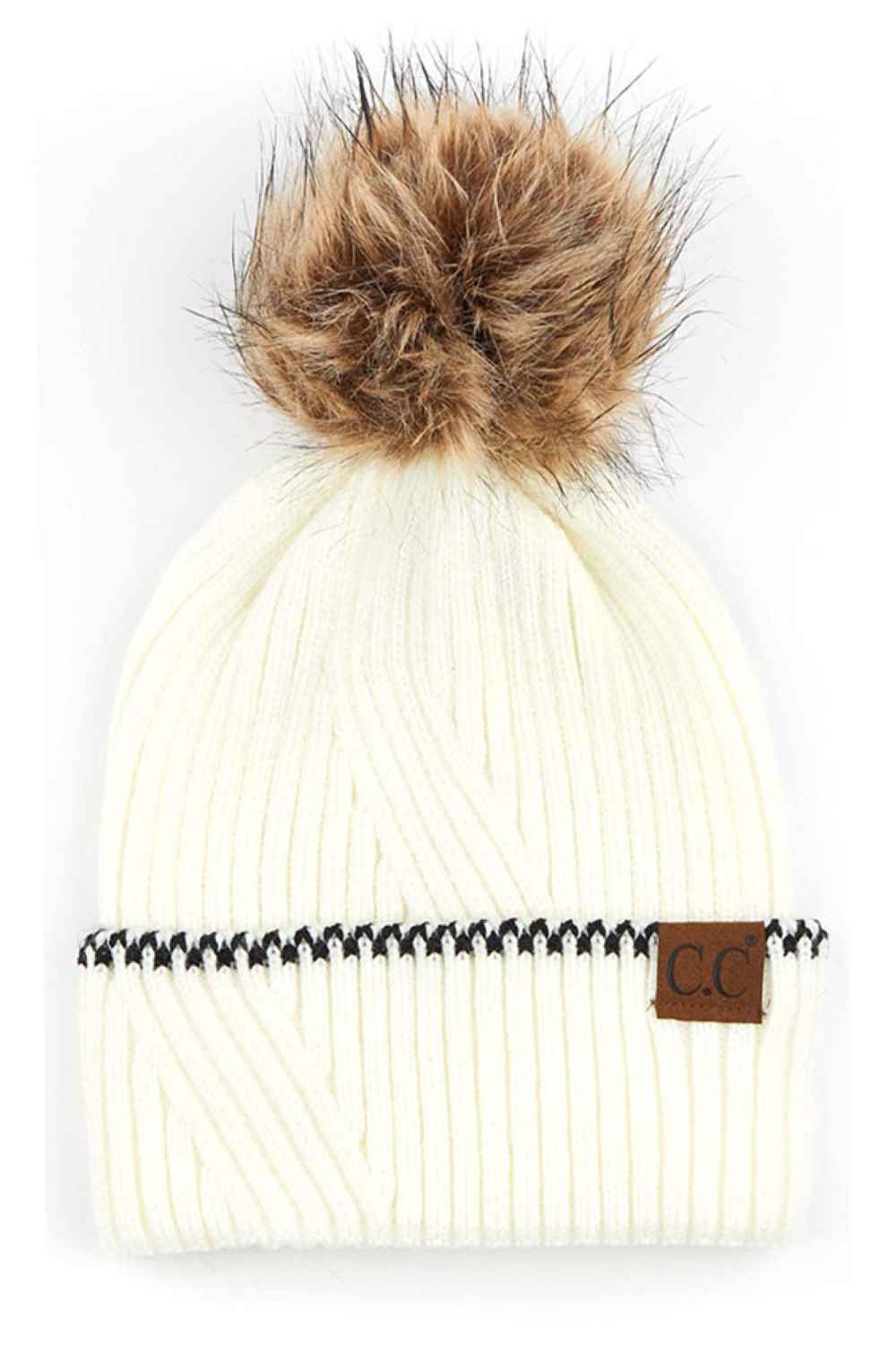 Ivory C.C Solid Pom Beanie with Accented Cuff Stay warm and stylish with this classic C.C solid pom beanie, designed for everyday comfort. Made from 100% acrylic, this lightweight knit offers softness and durability through winter seasons.
