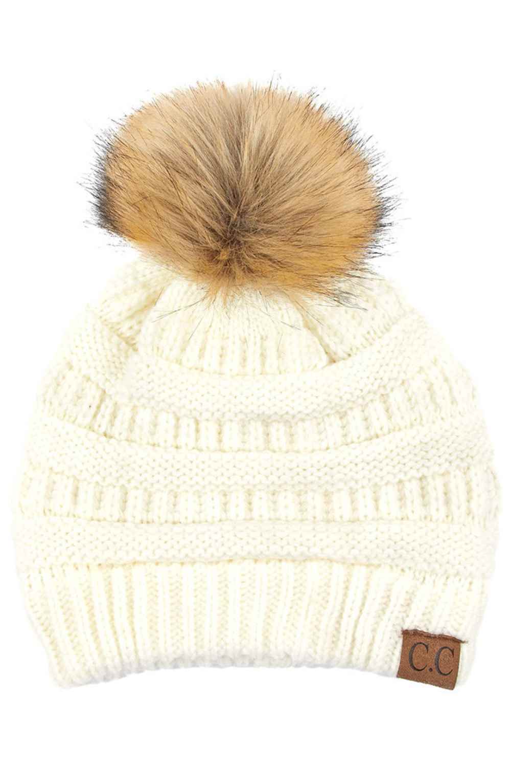 Ivory Stay warm and cozy with this classic C.C Pom Pom Knit Beanie, crafted from 100% soft acrylic for all-day comfort. The ribbed knit design adds texture and durability, while the signature pom pom on top brings a playful touch to any winter outfit. One size fits most, making it the perfect accessory for everyone. Ideal for cold weather adventures or casual everyday wear.