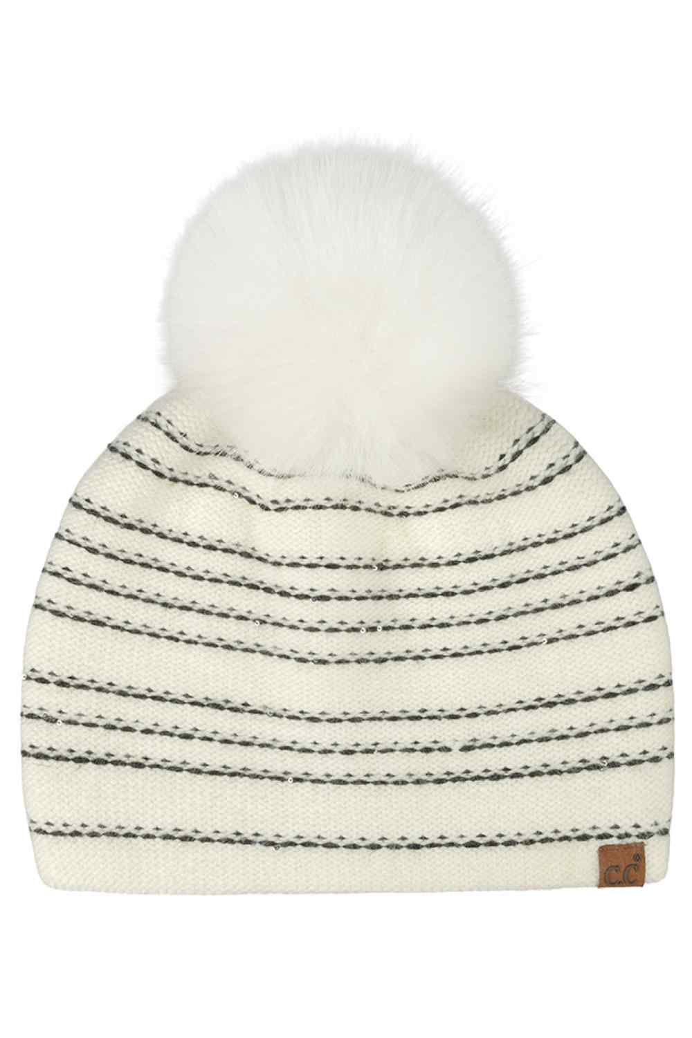 C.C Stripe Stitches with Sequin Ivory Angora Pom Beanie Winter Hat features cozy stripe stitching with shimmering sequin details and a fluffy angora pom for a chic winter-ready look. Designed with a soft stretch fit, it delivers warmth and comfort while adding a touch of sparkle to cold-weather outfits.