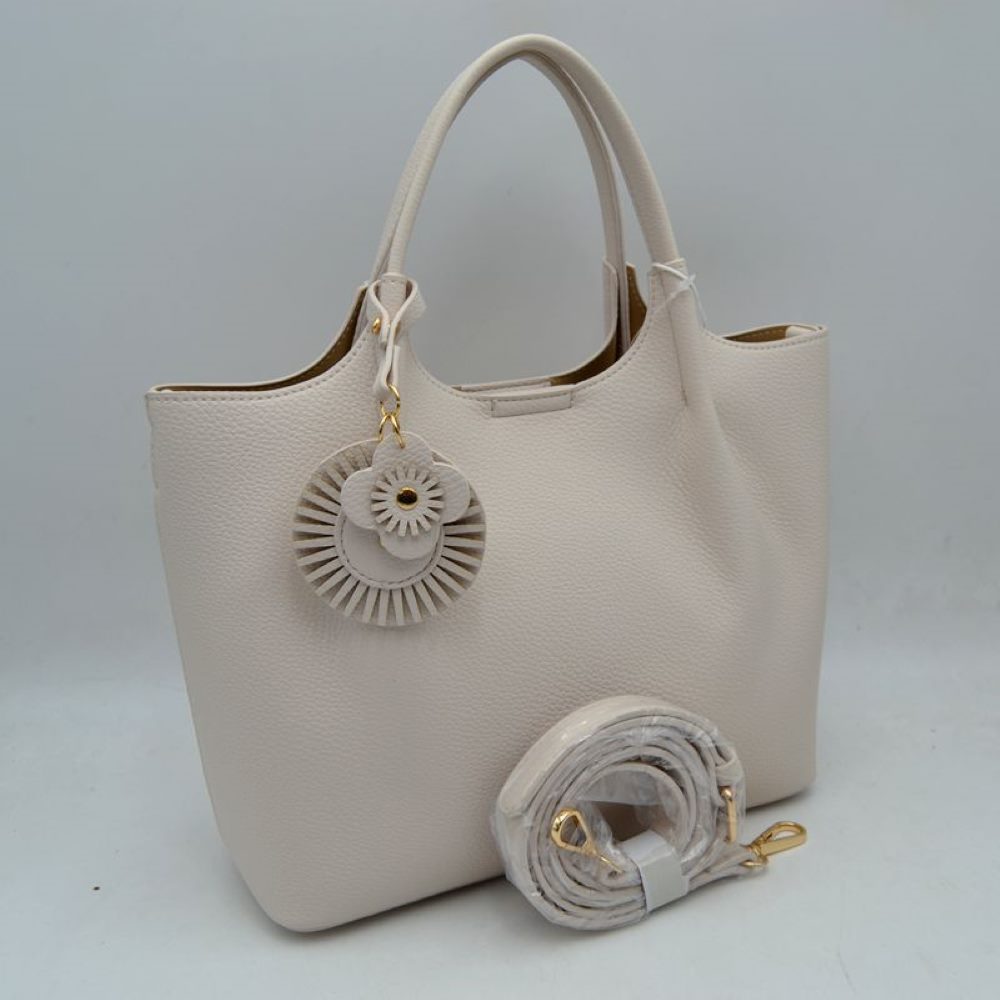 Ivory Elevate your everyday style with this versatile and sophisticated&nbsp;pebbled tote. Designed for the modern woman who values both form and function, this bag seamlessly transitions from a professional office setting to a casual weekend outing.