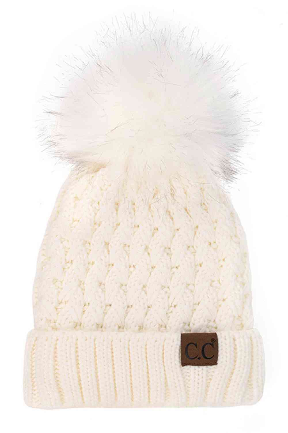 Ivory Elevate your winter wardrobe with the C.C Lattice Crossover Stitch Beanie, featuring an intricate lattice pattern and cozy pom detail. Crafted from 100% soft acrylic, this beanie delivers warmth and comfort without the weight. The crossover stitch design adds visual interest while the relaxed fit suits most face shapes. Perfect for layering over your favorite winter looks, this versatile beanie transitions effortlessly from casual outings to outdoor adventures. One size fits most for easy, everyday we