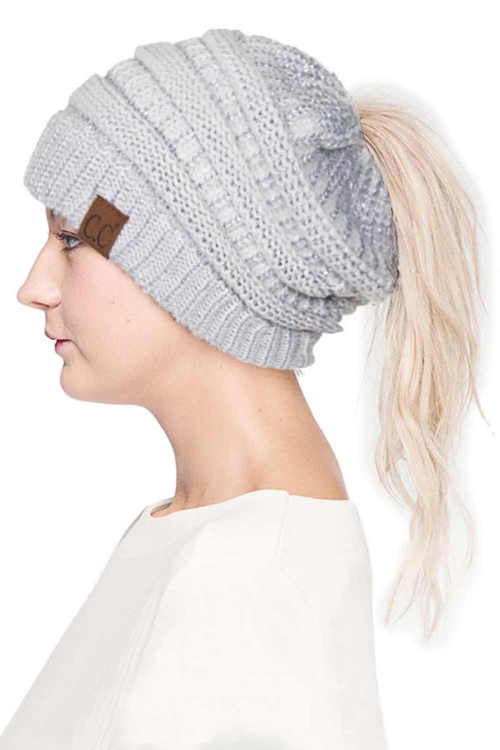 Ivory Silver Stay cozy and stylish with the C.C Metallic Messy Bun Ponytail Beanie, designed for effortless everyday wear. Crafted from 100% acrylic, this lightweight beanie features a sleek metallic finish that adds a modern touch to any outfit.
