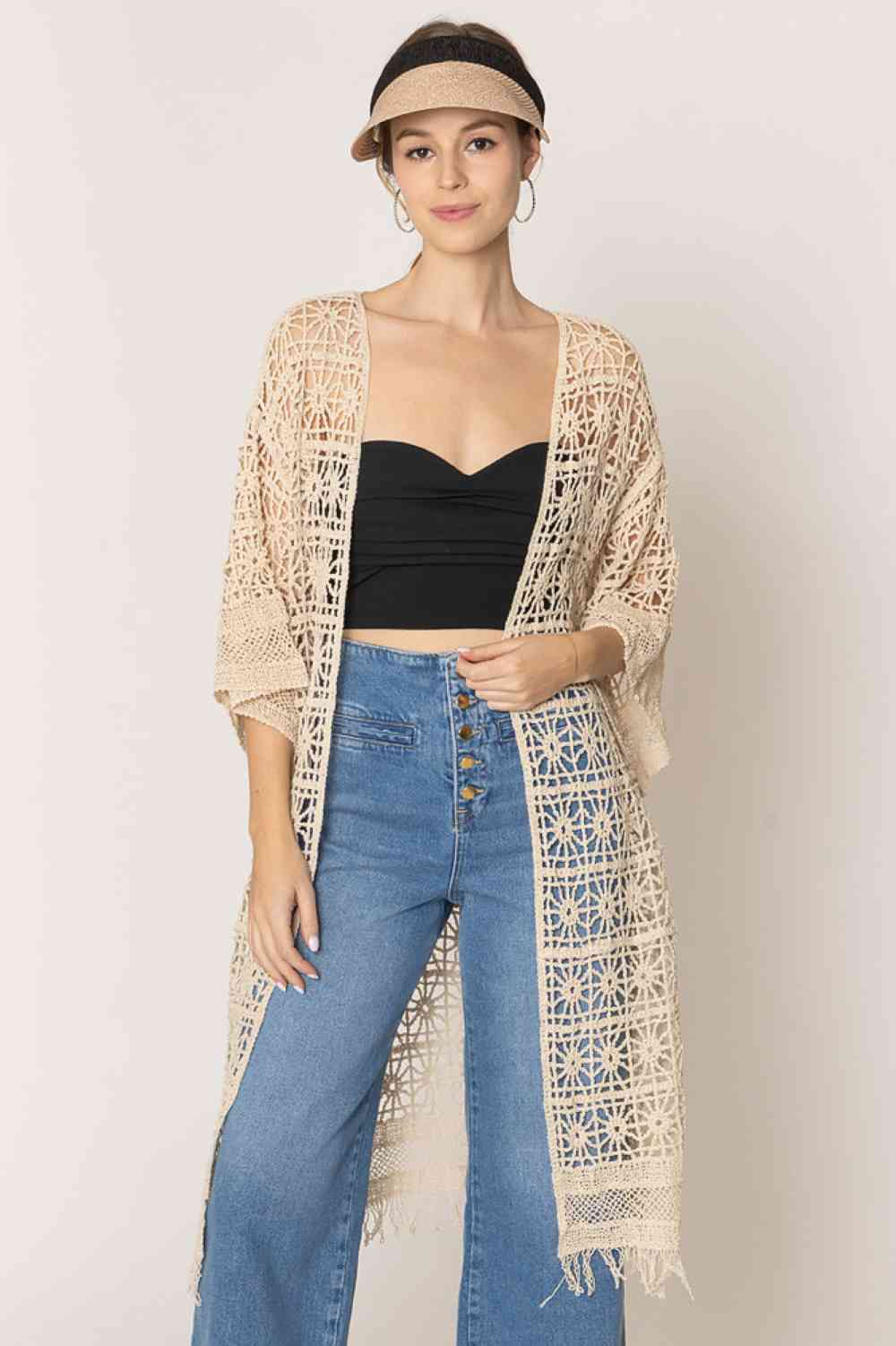 Ivory Effortless elegance meets comfort in this timeless crochet cardigan. Crafted from 100% cotton, it features an open-weave design that's breathable and perfect for layering. The relaxed fit measures 44" in length with a 20.5" width, offering a flattering silhouette for various body types. Ideal for casual days or dressed-up occasions, this versatile piece transitions seamlessly from season to season. A wardrobe staple that combines style with everyday wearability.