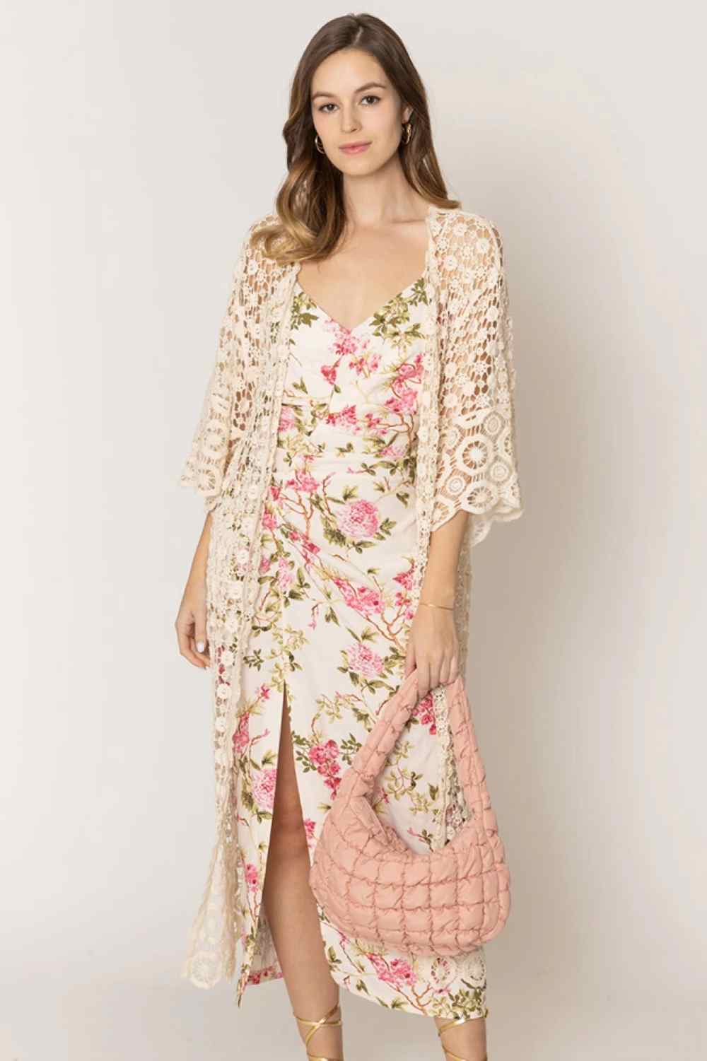 Ivory Effortless layering meets timeless style with this solid crochet cardigan. Crafted from 100% cotton, it offers breathable comfort perfect for any season. The relaxed fit and open-front design make it ideal for pairing over dresses, tees, or tanks. With generous dimensions of 43.3" x 21.3", this versatile piece transitions seamlessly from casual days to evening outings. A wardrobe essential that works as hard as you do.