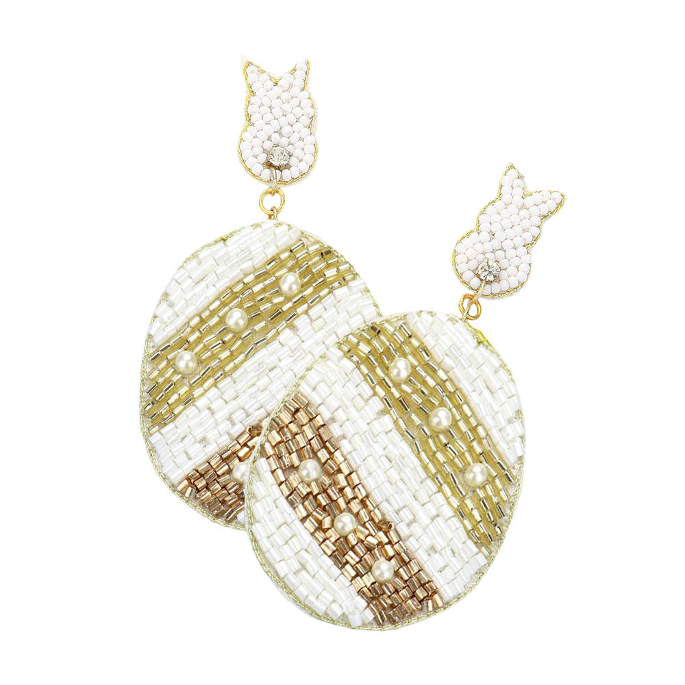 Ivory Felt Back Beaded Easter Bunny Egg Link Dangle Earrings are a festive addition to any Easter outfit. The unique design features a felt backing and delicate beaded details, providing a touch of whimsy and charm. These earrings are perfect for adding a fun and playful touch to your holiday look. 