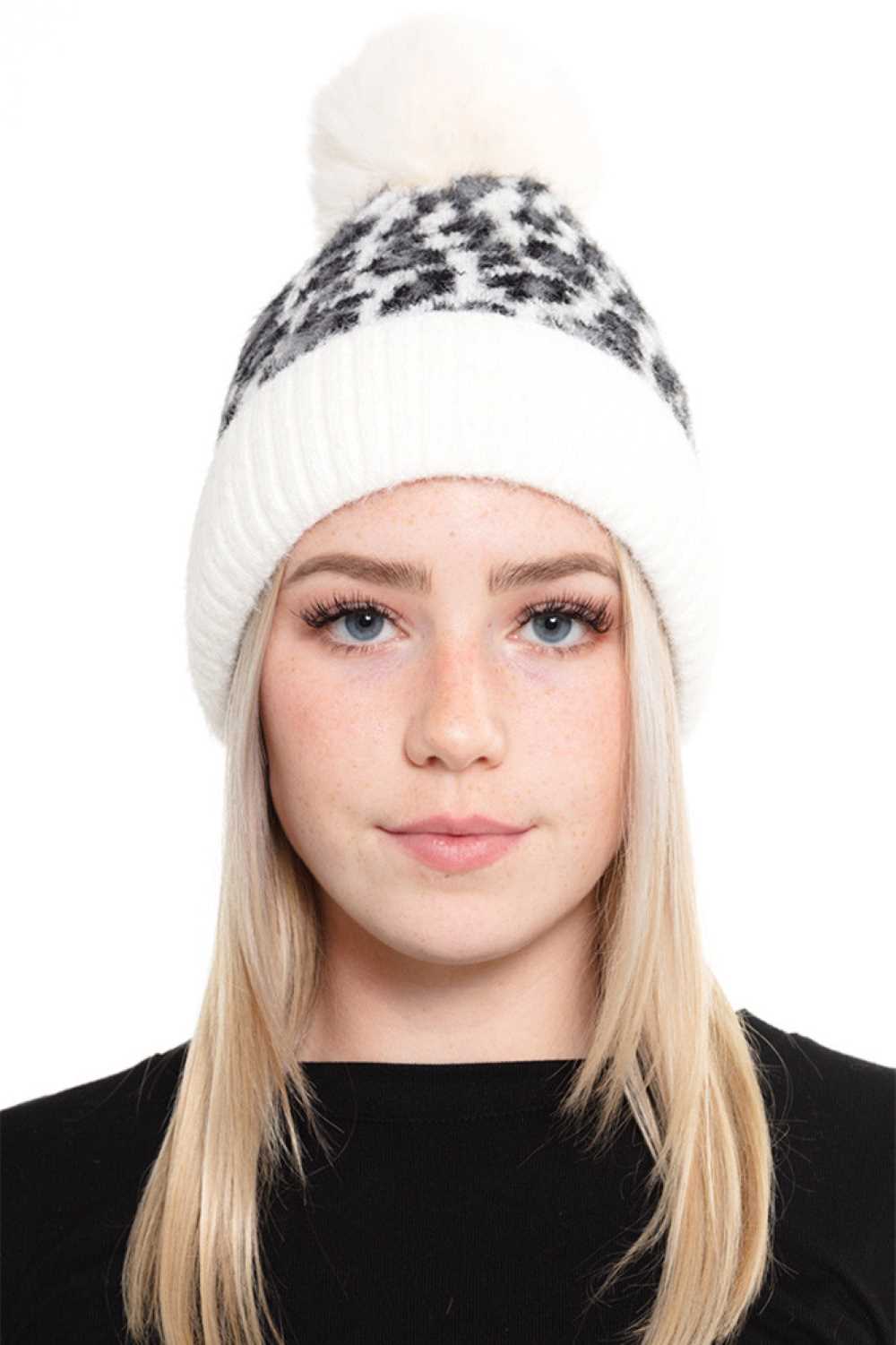 Ivory Cozy up in this Leopard Pom Fleece Beanie, featuring a playful leopard print design with a fuzzy pom-pom on top. Made from a soft blend of 50% acrylic and 50% nylon, this beanie delivers warmth and comfort for chilly days.