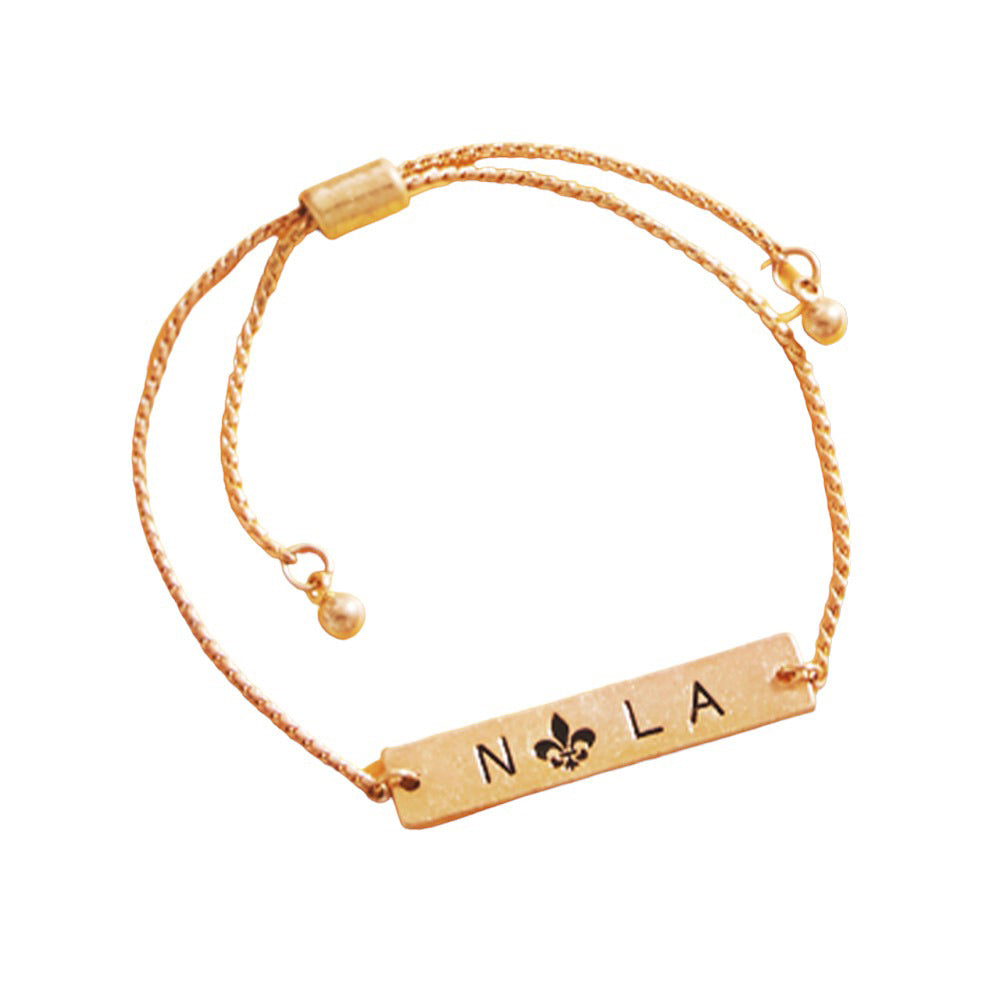 Jet Black Fleur de Lis Pointed Nola Message Pull Tie Cinch Bracelet, adds a sophisticated touch to any outfit. Crafted from an exquisite combination of materials, the bracelet features a Fleur de Lis pointed design with a Nola message pull tie cinch closure that makes it the perfect accessory for any occasion or as a lovely gift.