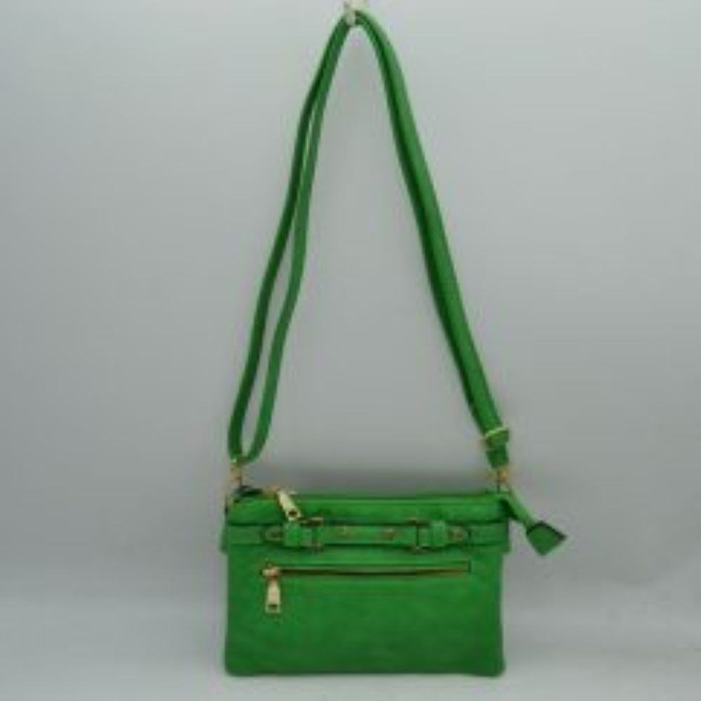 Kelly Green This functional crossbody bag is designed for organized everyday use, featuring a textured exterior equipped with multiple secure storage compartments. The front panel includes a convenient horizontal zippered pocket accented with an oversized metallic zipper pull, situated beneath a decorative horizontal band detailed with metallic studs and loops.