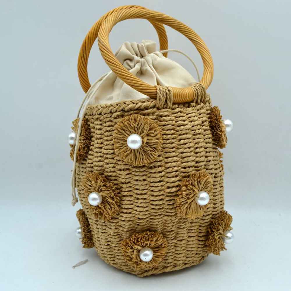 Khaki Infuse your daily style with a touch of resort-inspired luxury. This sophisticated bucket-style shoulder bag perfectly blends the airy feel of a woven summer tote with the structured polish of premium black accents, making it an incredibly versatile accessory for work, travel, or weekend getaways.
