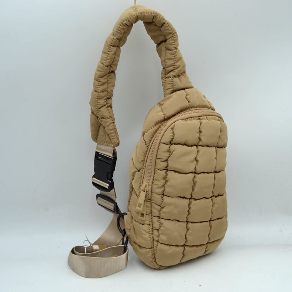 Khaki Stay effortlessly hands-free with the ultra-trendy sling bag. Combining an ergonomic, close-to-body fit with the highly sought-after puffer aesthetic, this compact pack is the ultimate accessory for city commuting, travel, hiking, or casual day trips.