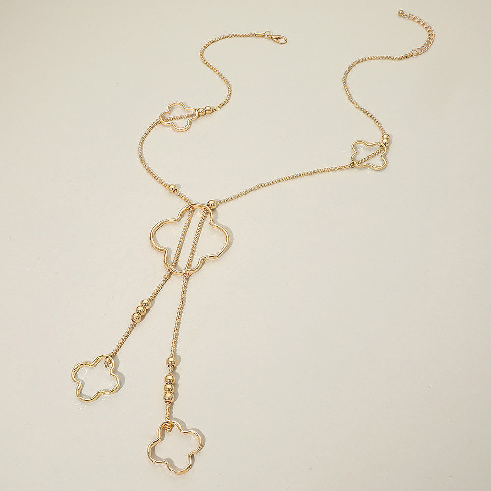Madeline Love Gold Hammered Metal Open Quatrefoil Long Necklace - Necklaces