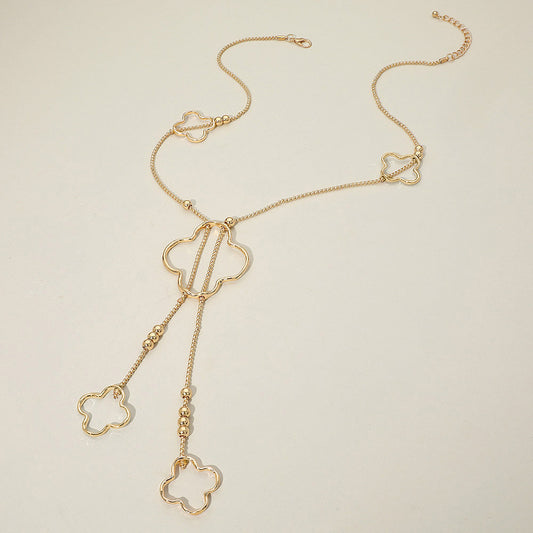 Madeline Love Gold Hammered Metal Open Quatrefoil Long Necklace - Necklaces