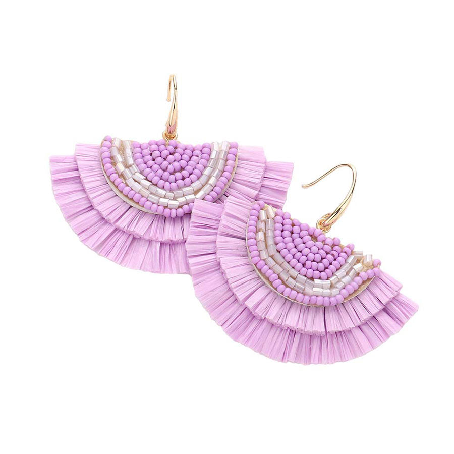 Lavender Bead Embellished Raffia Fringe Dangle Earrings, adorn yourself with these Raffia fringe dangle earrings! Enhance your attire with these vibrant artisanal earrings to show off your fun trendsetting style. 