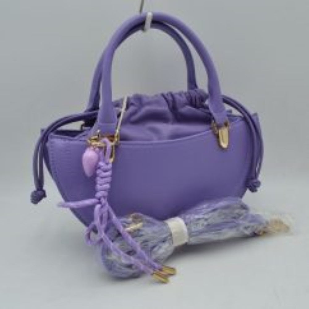 Lavender This everyday handbag showcases a structured crescent silhouette with a distinctive curved profile. Designed for versatility, it features dual rounded top handles alongside a detachable and adjustable long shoulder strap secured by metallic hardware. The interior storage includes a gathered inner pouch with a functional drawstring closure, while the outer shell forms an additional open compartment for quick-access items.