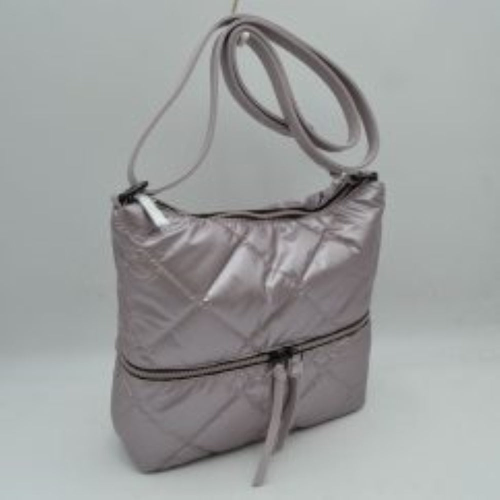 Lavender Stay organized in style with this quilted crossbody shoulder bag designed for everyday convenience. Featuring a spacious main compartment and a practical front zip pocket, it offers ample room for carrying daily essentials while keeping frequently used items within easy reach. The adjustable shoulder strap provides comfortable wear throughout the day, making it suitable for work, travel, shopping, or casual outings.