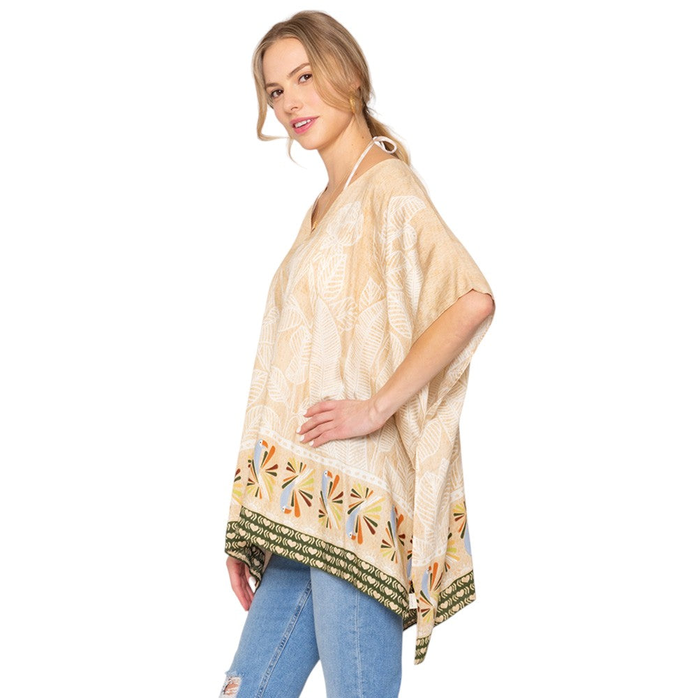 Tan Leaf Print Cover Up Poncho is the perfect addition to your summer wardrobe. Made from lightweight fabric, it is both stylish and functional, providing coverage from the sun while keeping you cool. The leaf print adds a touch of nature-inspired elegance to any beach or pool ensemble. 